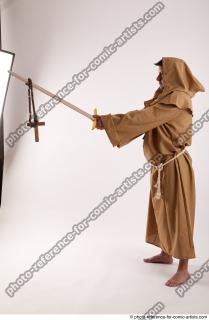03 2018 01 PAVEL MONK STANDING POSE WITH SWORD AND…